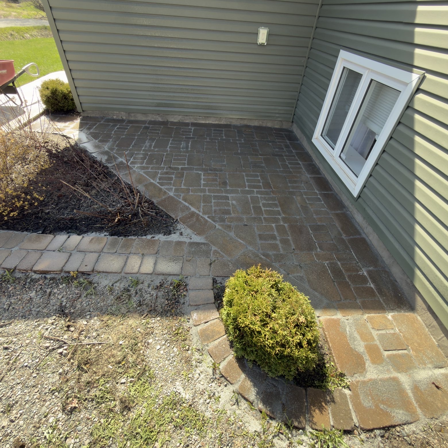 Freshly pressure-washed stone patio